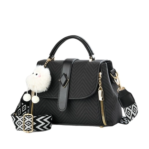 Retro black crossbody bag with quilted texture and geometric wide strap and sheep pendant