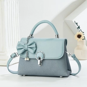 Light blue bow handbag with pearl charm and woven texture for women's crossbody wear
