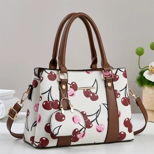 Chic cherry print women's handbag set with matching mini pouch and brown leather trim