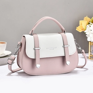 Chic pink and white leather crossbody messenger bag with silver hardware and top handle