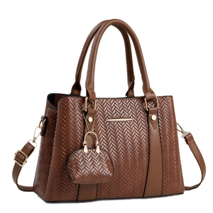 Brown woven pattern tote bag with shoulder strap and mini pouch on white background