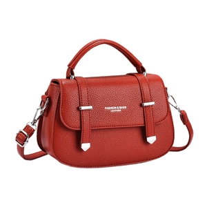 Chic brick red leather square handbag with silver accents and adjustable shoulder strap