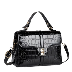 Glossy black crocodile embossed leather handbag with gold buckle and top handle