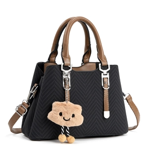 Chic black quilted tote bag with brown handles and a cute cloud charm for women