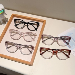Detailed view of cat-eye glasses in five colors with elegant gold metal accents