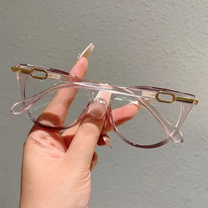Detailed shot of pink-purple gradient resin eyeglass frames with gold metal accents