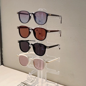 Minimalist oversized round sunglasses set in four colors with retro frames and gold hinges