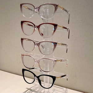 Elegant cat-eye glasses frames in multiple colors with gold metal temples and sharp details