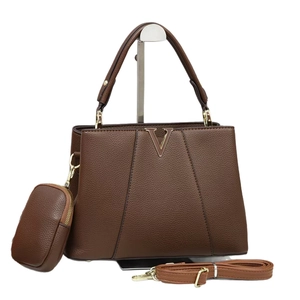 Dark brown pebbled leather tote bag set with golden V-logo and crossbody strap