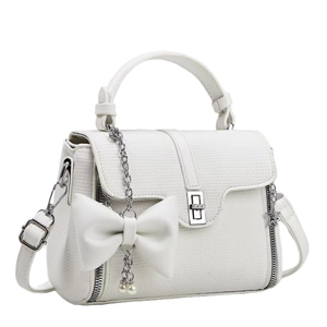 White textured handbag with bow charm and pearl strap on minimalist background