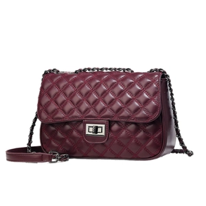 Deep red quilted leather shoulder bag with silver chain strap and metallic lock clasp
