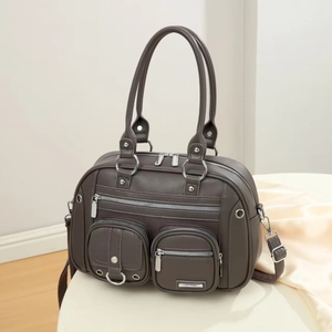 Taupe pebbled leather messenger bag with multiple pockets and silver hardware detail