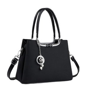 Large black textured tote bag with silver metal trim, pearl star pendant and top handles