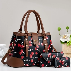 Ensemble de trois sacs noirs à motif cerise avec poignées en cuir marron