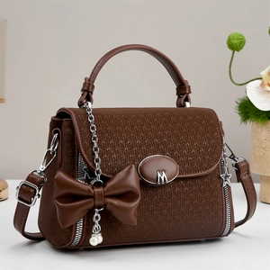 Brown woven texture crossbody bag with metal M logo and leather bow pearl pendant