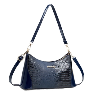 Deep blue faux crocodile leather handbag with elegant gold hardware and top handle design