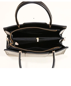 Internal structure of black leather tote with multiple compartments and golden zippers