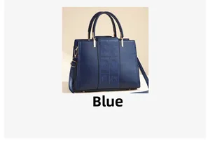 Detail of elegant navy blue handbag with embroidered rose patterns on the front panel