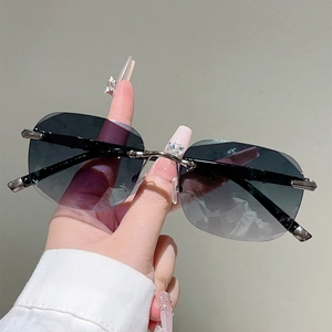 Rimless punk sunglasses with gradient lenses and silver heart rhinestone bridge detail