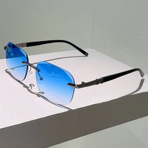 Detail of blue gradient rimless sunglasses with gunmetal temples and textured accents