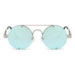 Detail of silver double bridge metal frame and light blue round lenses of retro sunglasses