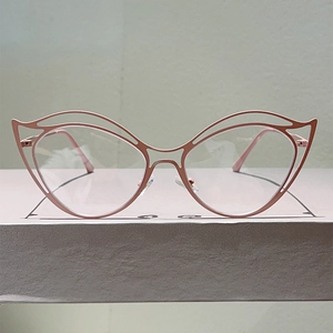 Modern hollow cat-eye anti-blue light glasses with rose gold metal frame in artistic design