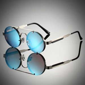 Detail of silver steampunk sunglasses with blue mirrored lenses and spring temples