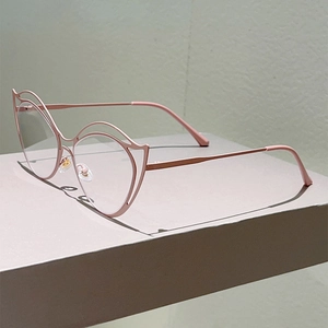 Detail of pink cat eye metal frame glasses showing double-layered hollow design