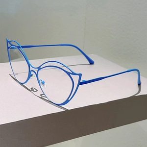 Modern blue cat-eye hollow metal frame glasses with transparent lenses on a minimalist stand