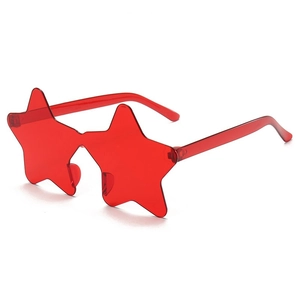 Detail of red rimless star shaped party sunglasses with sleek Y2K aesthetic design