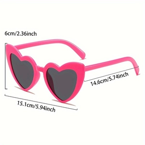 Detail view of pink heart-shaped sunglasses with dimensions showing frame size and width