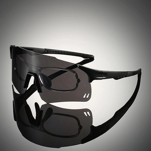 Detail view of sports sunglasses featuring dual-lens structure and matte black frame