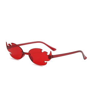 Detail of red flame shaped rimless sunglasses with translucent lenses for parties