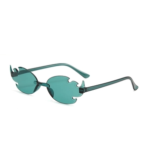 Detail shot of teal flame-shaped rimless sunglasses for parties and creative styling