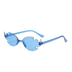 Detail shot of blue rimless flame shaped sunglasses with sharp edges for parties