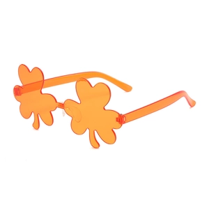 Unique orange clover-shaped flower sunglasses with integrated translucent festive frames