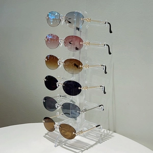 Lunettes de soleil ovales sans monture avec branches en métal doré et dégradés