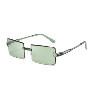 Detail of rimless rectangle sunglasses with light green lenses and transparent temples