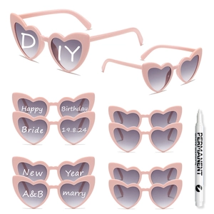 Pink heart-shaped sunglasses set with white DIY marker for custom party messages