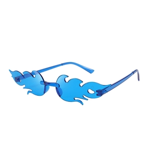 Detail view of transparent blue flame-shaped party sunglasses with rimless design