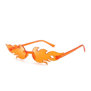 Detail shot of bright orange flame-shaped rimless sunglasses with transparent lens design