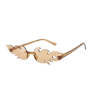 Detail view of wave-shaped brown flame sunglasses with rimless creative design