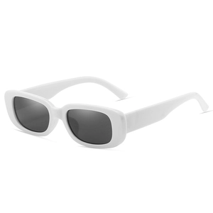 Close-up of white rectangular sunglasses featuring glossy frames and dark grey lenses