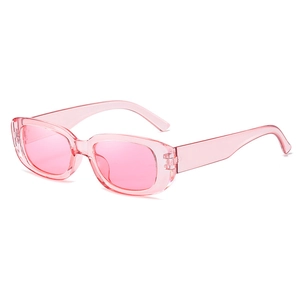 Detail of pink transparent rectangular sunglasses with lightweight trendy plastic frames