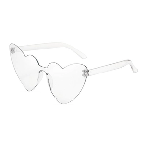 Macro view of transparent heart-shaped rimless party sunglasses with an integrated design
