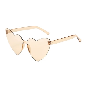 Detail view of heart-shaped rimless sunglasses in champagne tint with a seamless PC frame