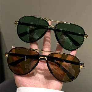 Classic aviator sunglasses with dual metal bridge and tinted green and brown lenses