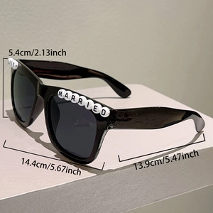 Detail of square black sunglasses with Just Married letter beads for wedding parties