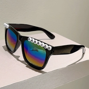 Detail of Just Married black square sunglasses with iridescent lenses for wedding party