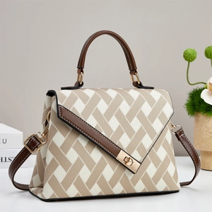 Fashion beige woven handbag with brown leather trim and golden metal swivel lock closure